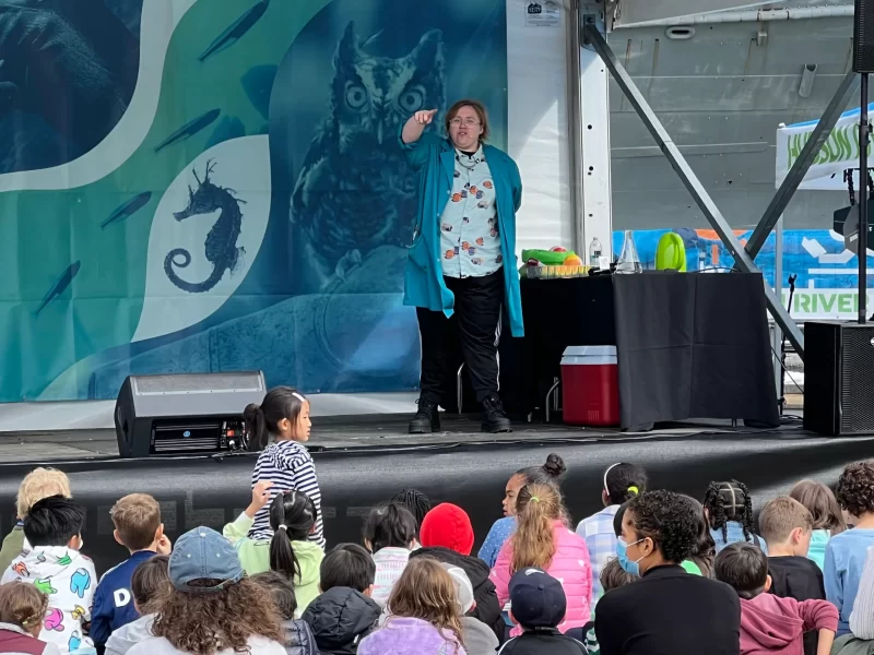 Teacher teaching scientific facts to the crowd