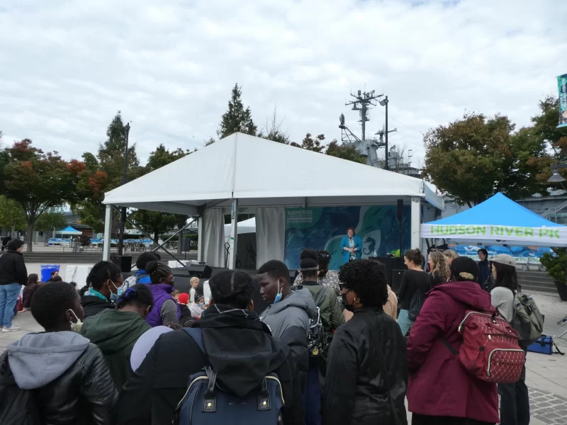 crowd gathering in front of a tent